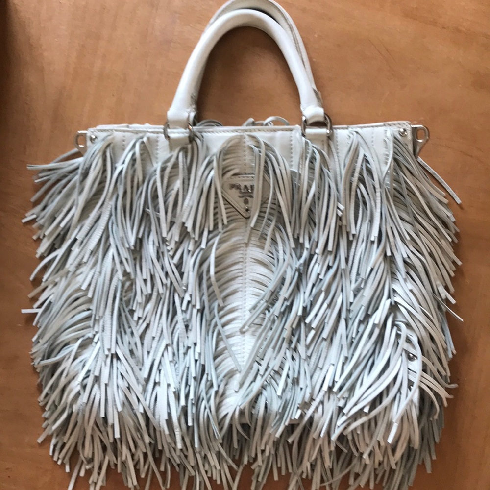 Prada. White fringe crossbody strap included